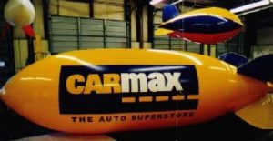 advertising blimp with CarMax logo for auto dealers in Harrison